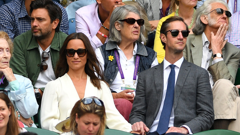 Pippa Middleton holding hands with James Matthews