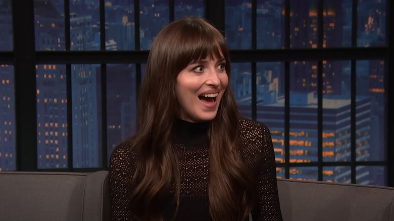 Dakota Johnson with stunned expression