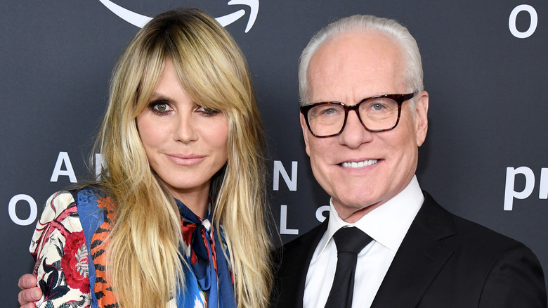 Heidi Klum and Tim Gunn posing at a red carpet event