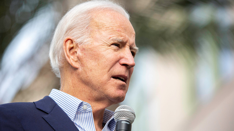 Joe Biden speaking with microphone 