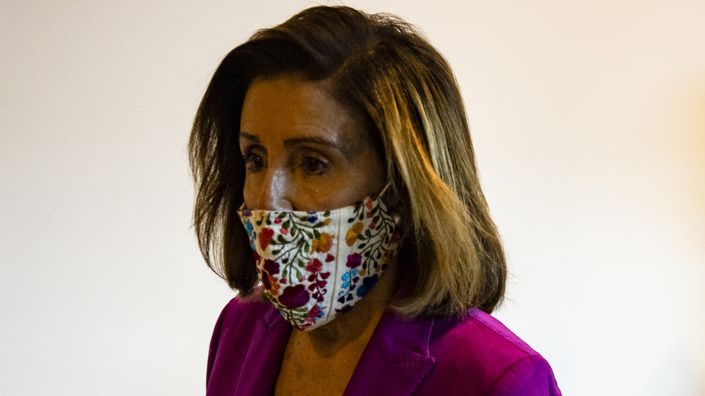 Nancy Pelosi wearing a mask