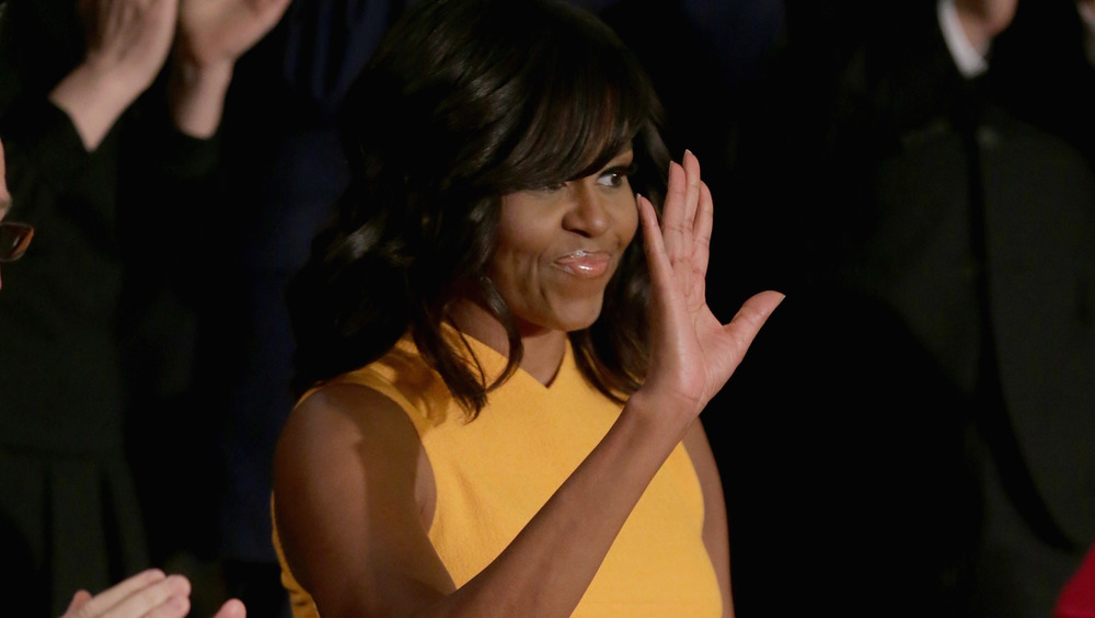 Former First Lady Michelle Obama waving at the 2016 State of the Union 