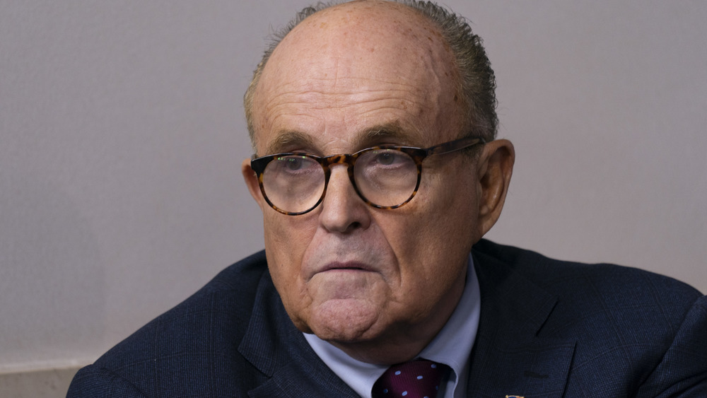 Rudy Giuliani listens to President Trump speak during a news conference in 2020