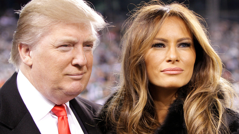 Donald and Melania Trump posing and smiling together