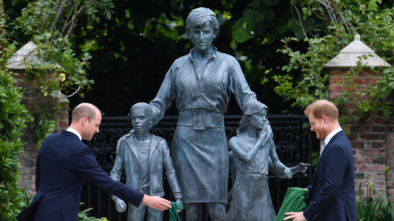 Princess Harry and William with their statue of Diana