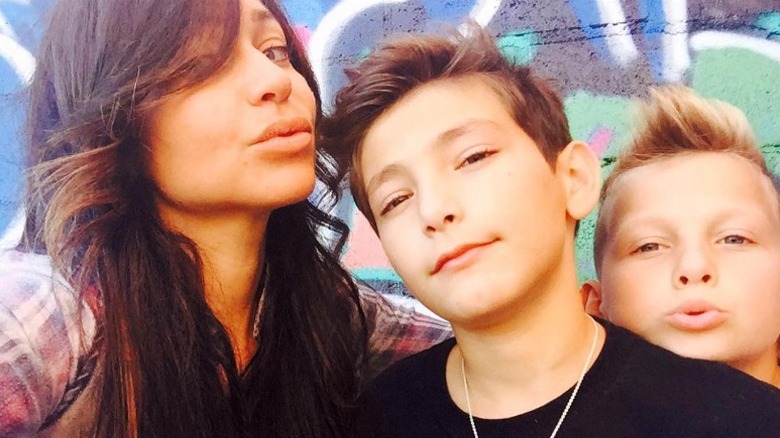 Stacey Silva posing with sons Mateo and Parker