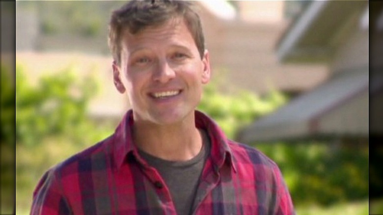 Bill Beckwith smiling, wearing red plaid shirt