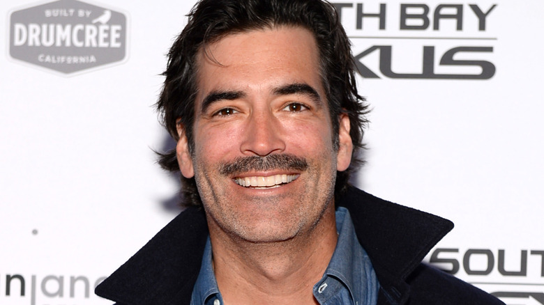 Carter Oosterhouse smiling with mustache