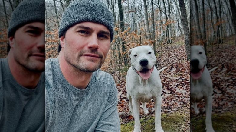 Josh Hall posing with his dog