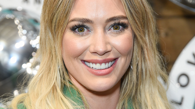 Hilary Duff smiling with blonde hair 