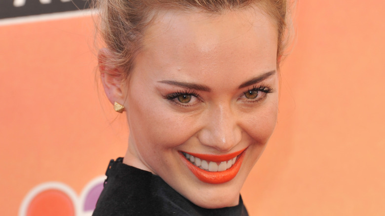 Hilary Duff posing orange lipstick