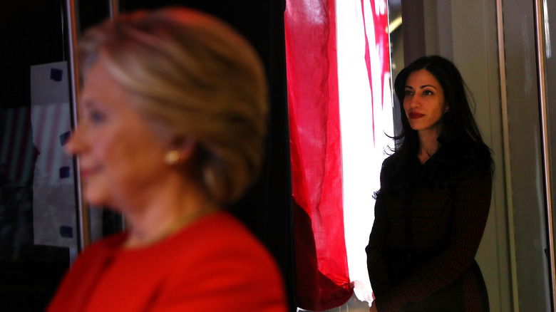 Huma Abedin stands behind Hillary Clinton during the election's final hours