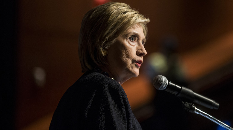 Hillary Clinton microphone serious face 