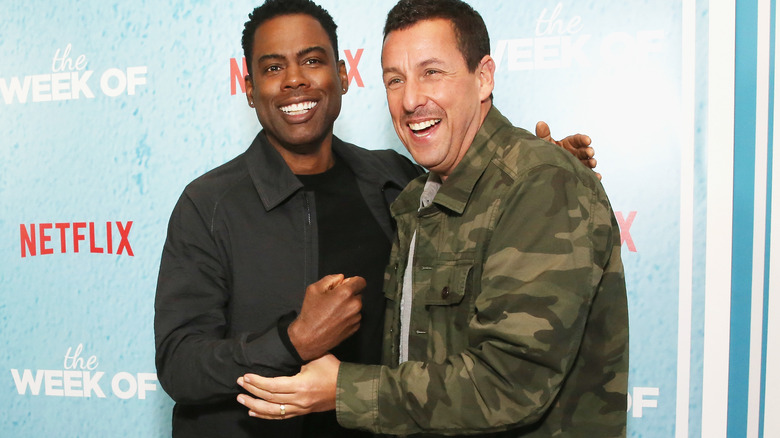 Chris Rock and Adam Sandler laughing 