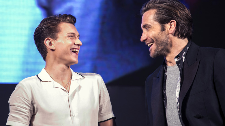 Tom Holland and Jake Gyllenhaal smiling 