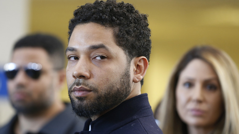 Jussie Smollett looking behind himself