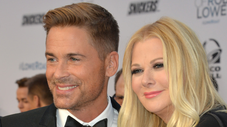 Rob Lowe and his wife Sheryl Berkoff posing and smiling together