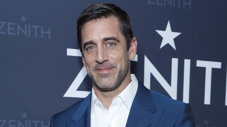 Aaron Rodgers poses on the red carpet at launch event for his Zenith x Aaron Rodgers watch