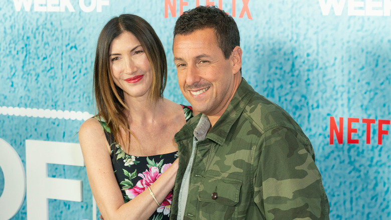 Jackie and Adam Sandler at a premier in 2018