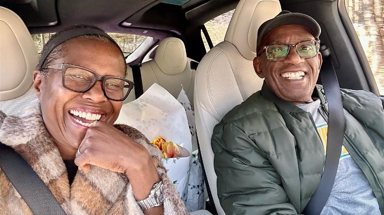 Deborah Roberts and Al Roker driving smiling