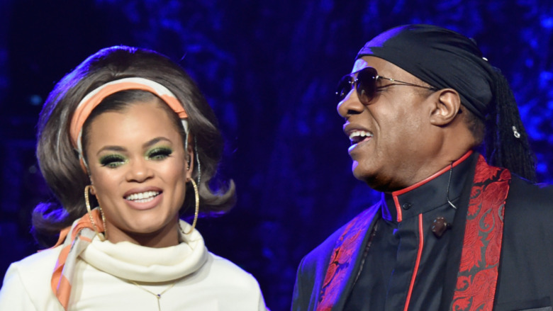 Andra Day and Stevie Wonder perform on stage