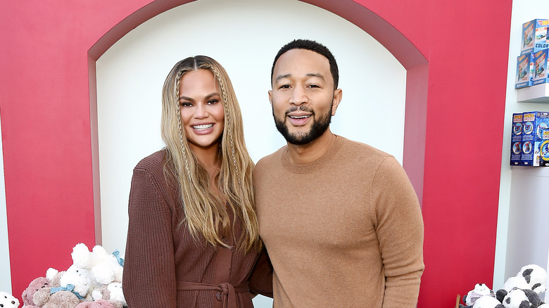 John Legend and Chrissy Teigen smile 