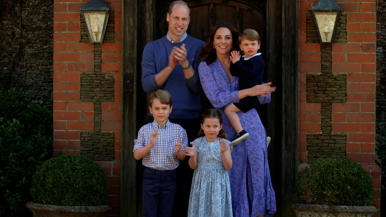 Prince William and Kate Middleton outside their home with George, Charlotte and Louis