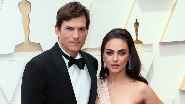 Ashton Kutcher and Mila Kunis pose 