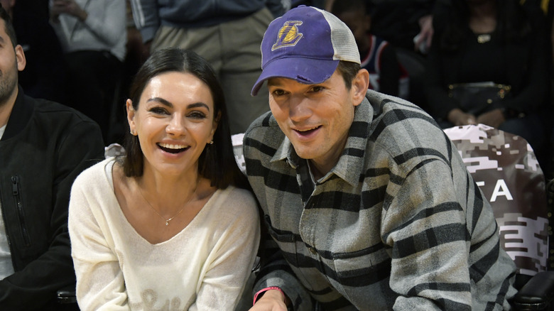 Ashton Kutcher and Mila Kunis smile 