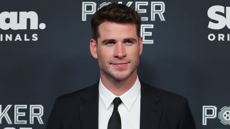 Liam Hemsworth smiling on the red carpet