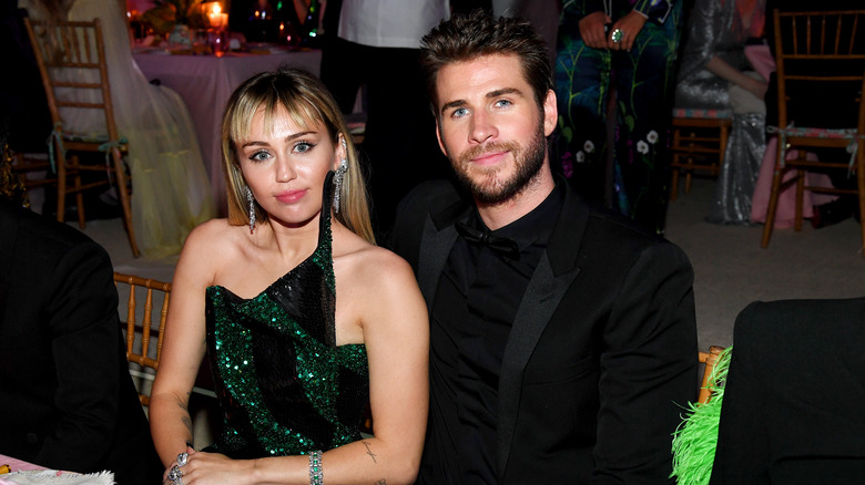 Miley Cyrus and Liam Hemsworth posing together