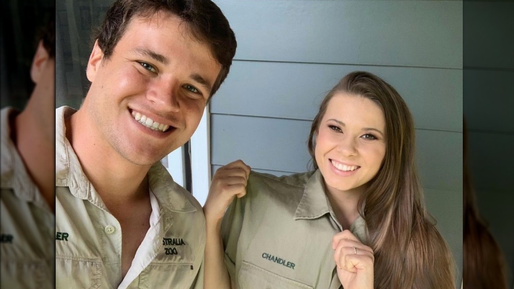 Chandler Powell and Bindi Irwin smile for a selfie 