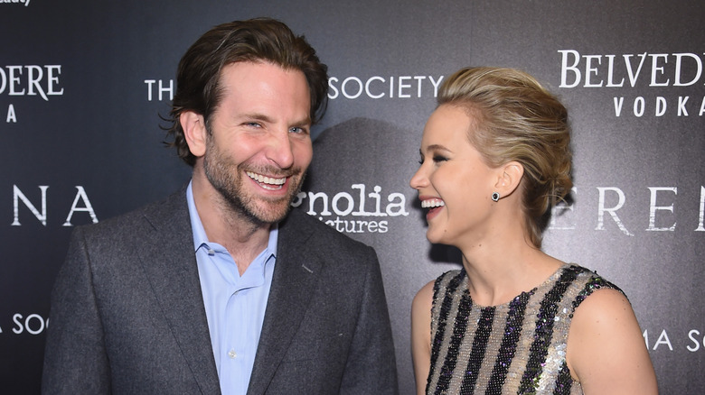 Jennifer Lawrence and Bradley Cooper laugh together