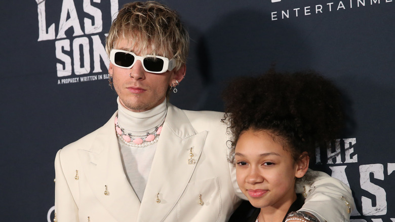 Machine Gun Kelly and Casie Colson Baker posing