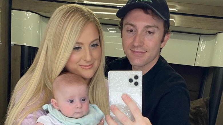 Meghan Trainor, Daryl Sabara, and their son, Riley posing