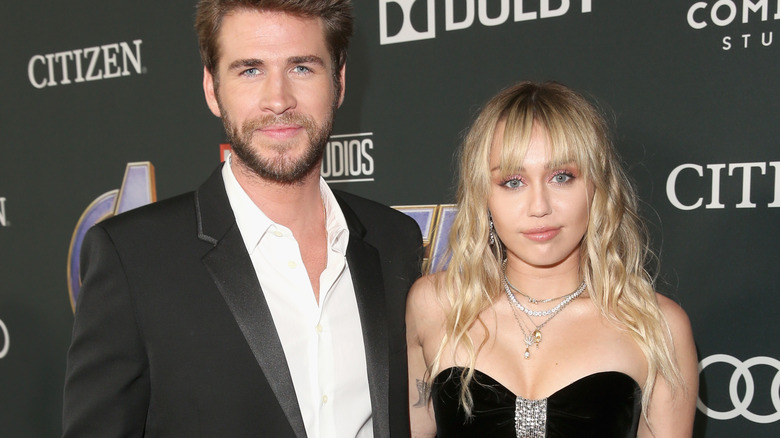 Miley Cyrus Liam Hemsworth pose for photo