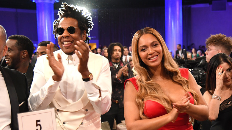 Beyoncé and Jay-Z clapping at event