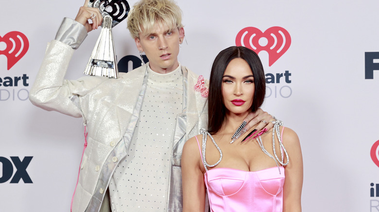 Machine Gun Kelly and Megan Fox posing