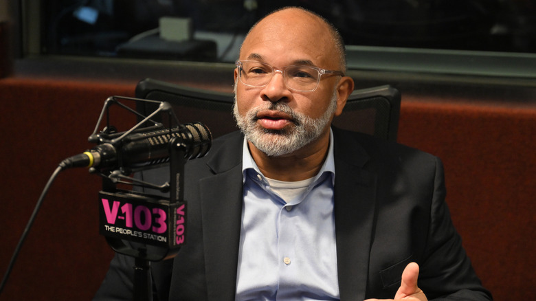 Geoffrey Owens talks into the mic during radio interview