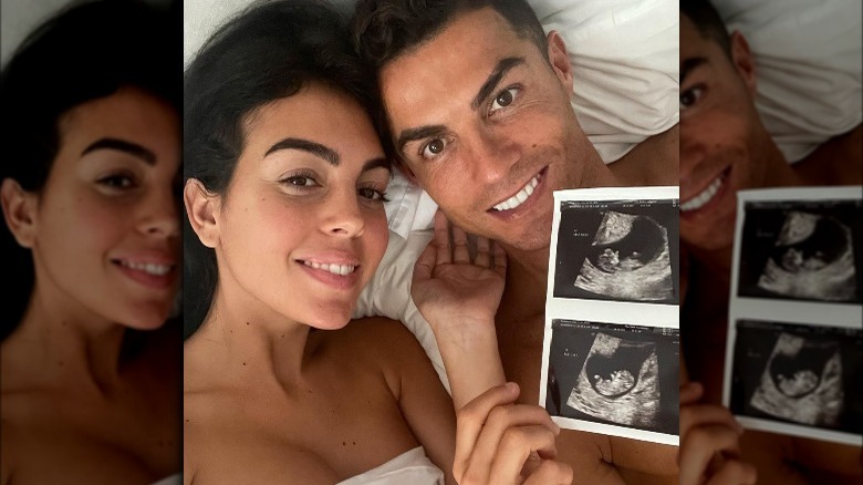 Cristiano Ronald and Georgina Rodriguez with sonogram in bed