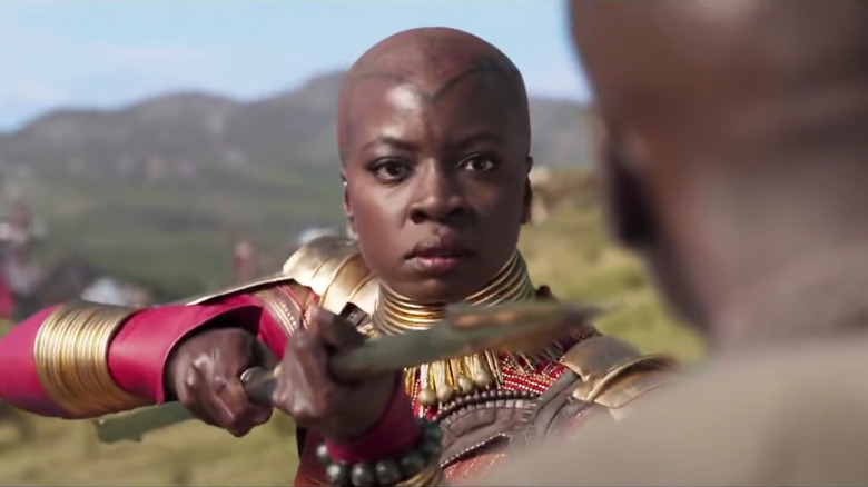 Danai Gurira holding spear in "Black Panther"