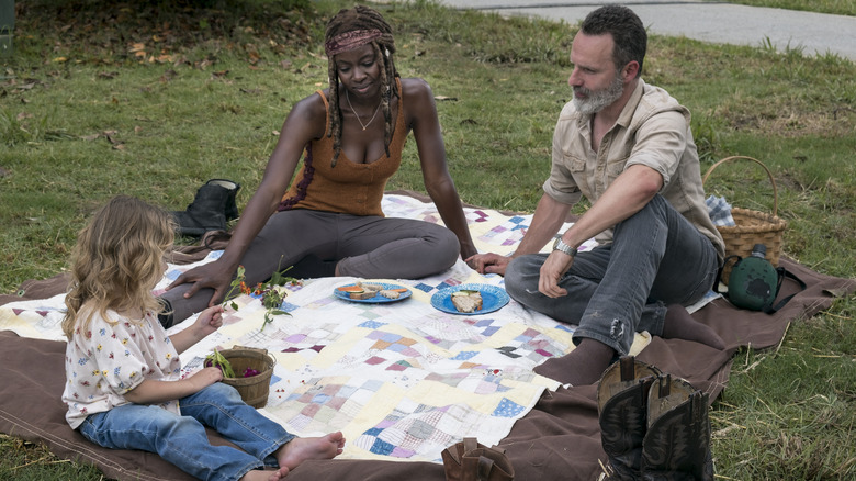 Danai Gurira, Andrew Lincoln, and Chloe Garcia-Frizzi on a blanket