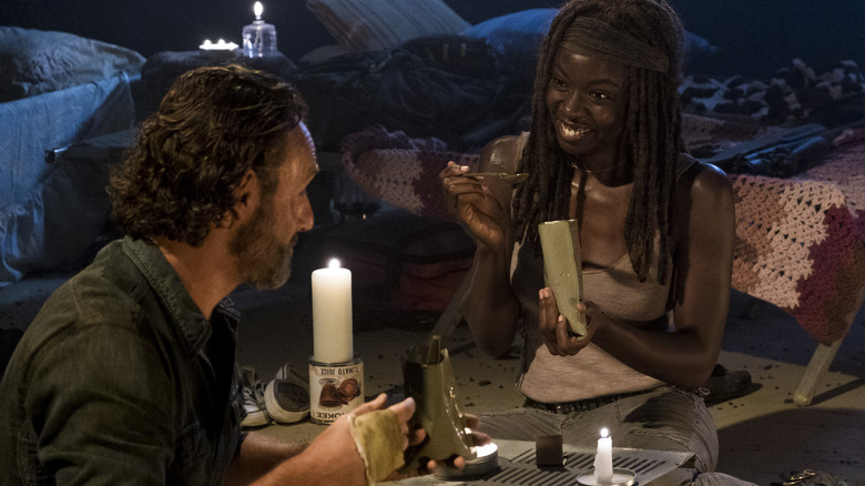 Danai Gurira smiling at Andrew Lincoln