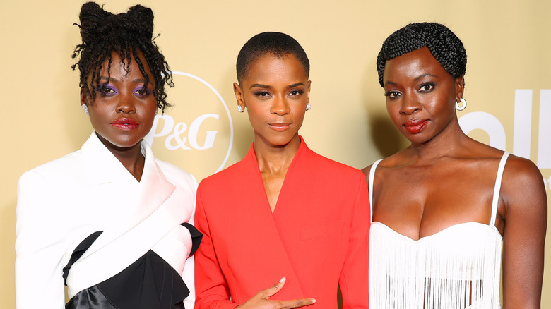 Lupita Nyong'o, Letitia Wright, and Danai Gurira posing