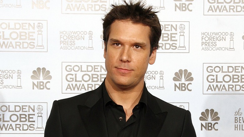 Dane Cook poses in a black shirt in 2007