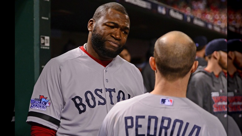 David Ortiz talking with Dustin Pedroia in the dugout