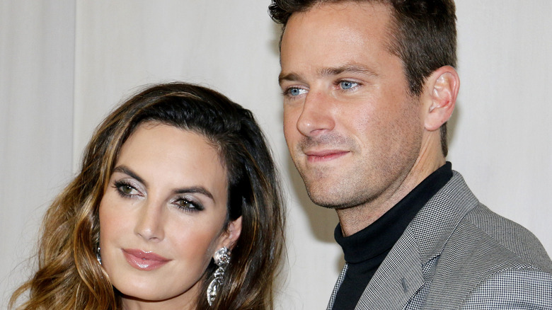 Elizabeth Chambers and Armie Hammer posing