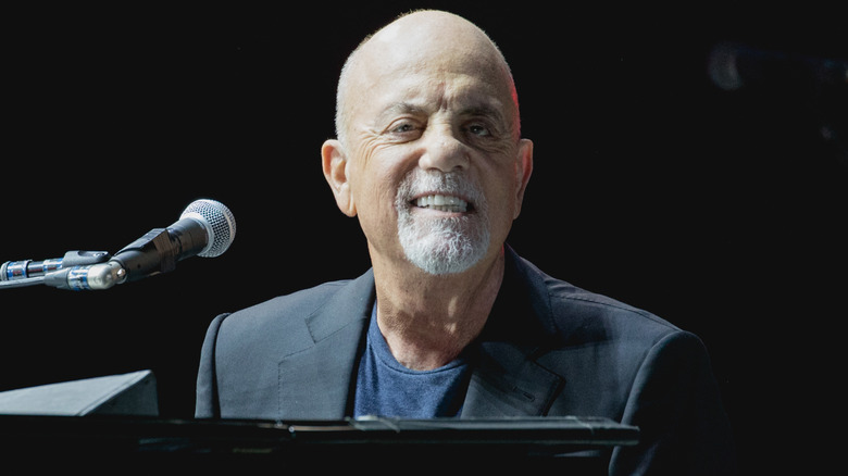 Billy Joel performing onstage in 2021