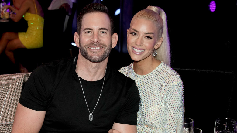 Tarek El Moussa and Heather Rae Young pose for a picture together