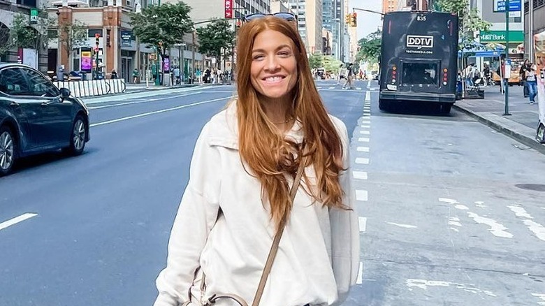 Jenn Todryk stands in a New York street